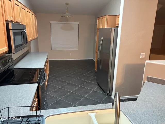 a view of a living room with furniture and a fireplace