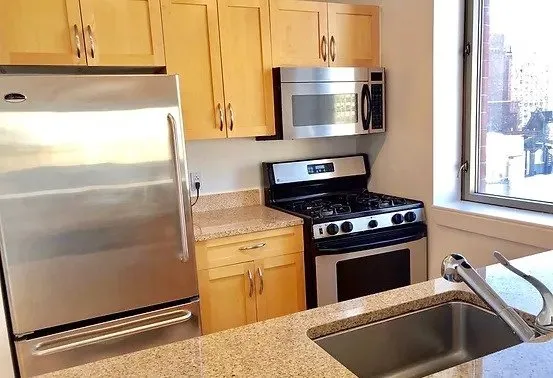 a view of a room with furniture and window