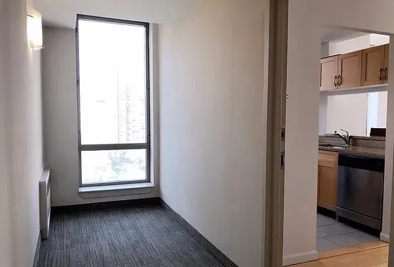 a room with gym equipment and windows