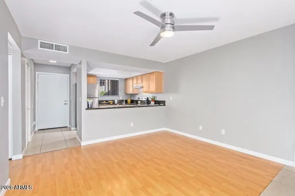 a kitchen with granite countertop a sink stove and cabinets