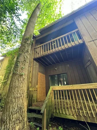 a view of balcony with wooden floor