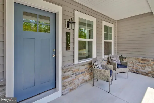 a living room with furniture and a gate