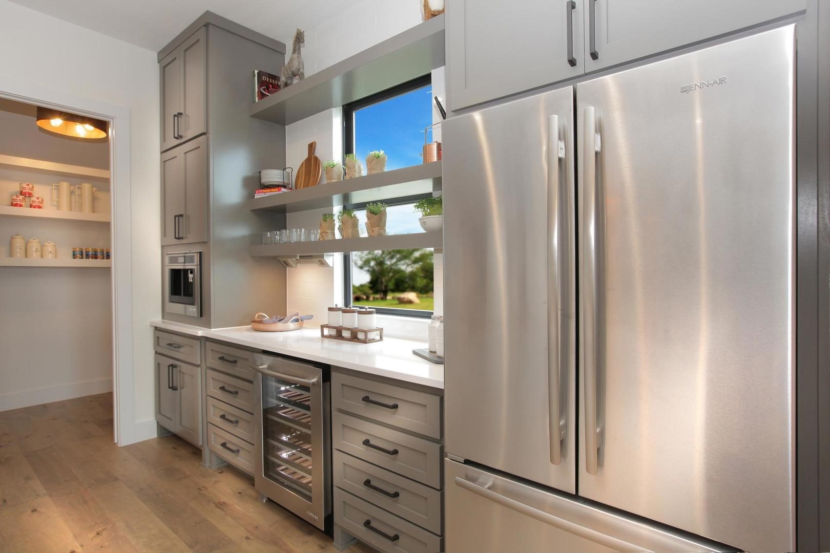 6918 Pyle Lane Friendswood, TX 77546 - Photo 5 of 6 a kitchen with stainless steel appliances a refrigerator and a sink
