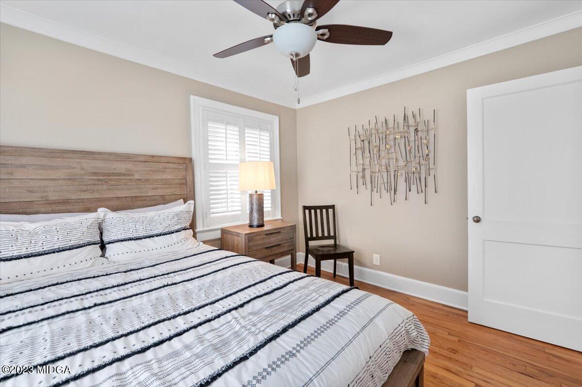 394 Overlook Road Macon, GA 31204 - Photo 12 of 29 a bedroom with a bed and a chandelier