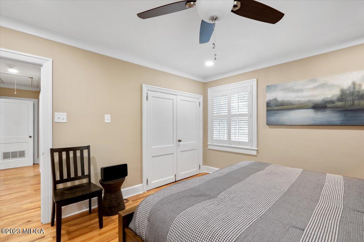 394 Overlook Road Macon, GA 31204 - Photo 13 of 29 a bedroom with a bed and a chair