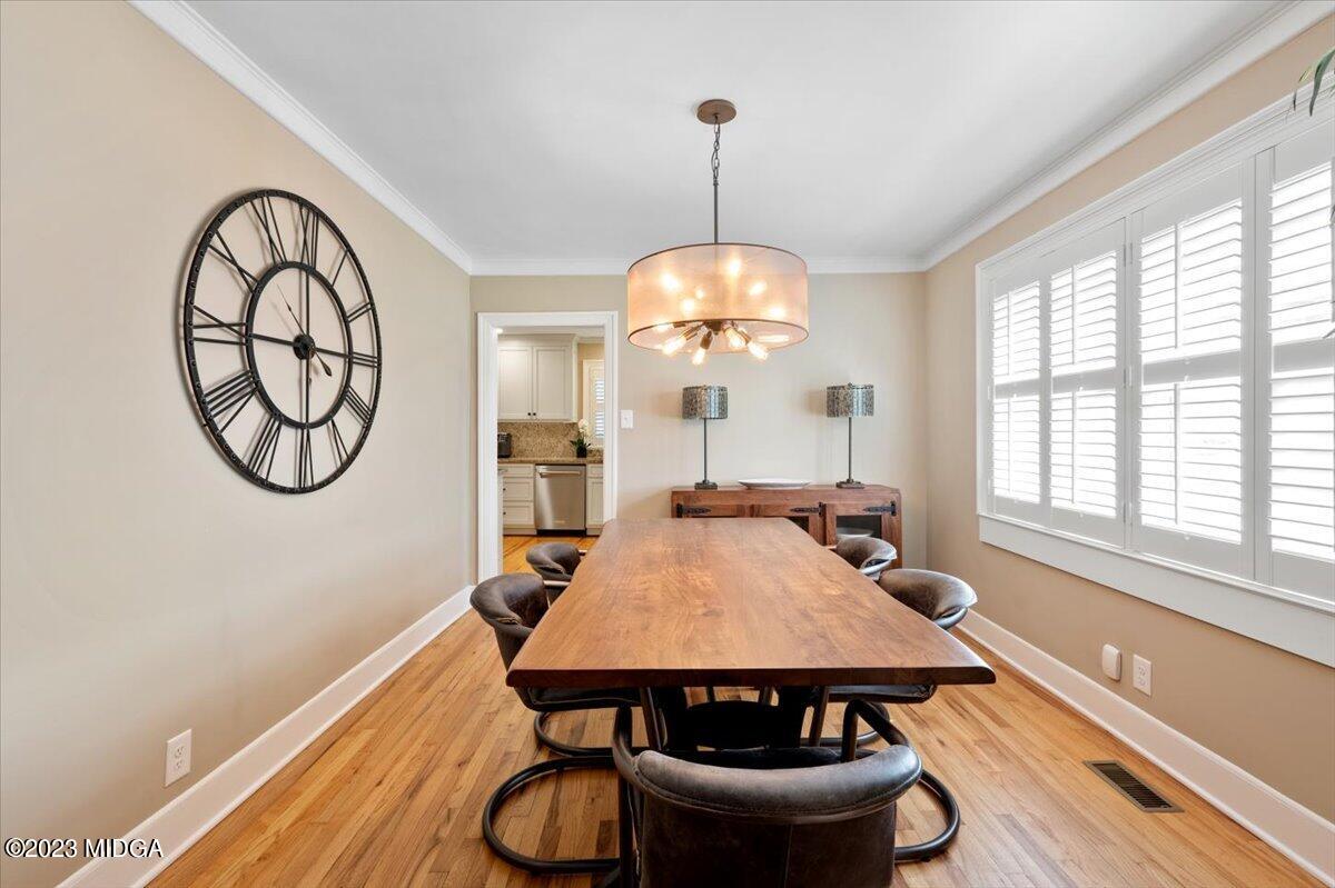 394 Overlook Road Macon, GA 31204 - Photo 14 of 29 a dining room with furniture a chandelier and a rug