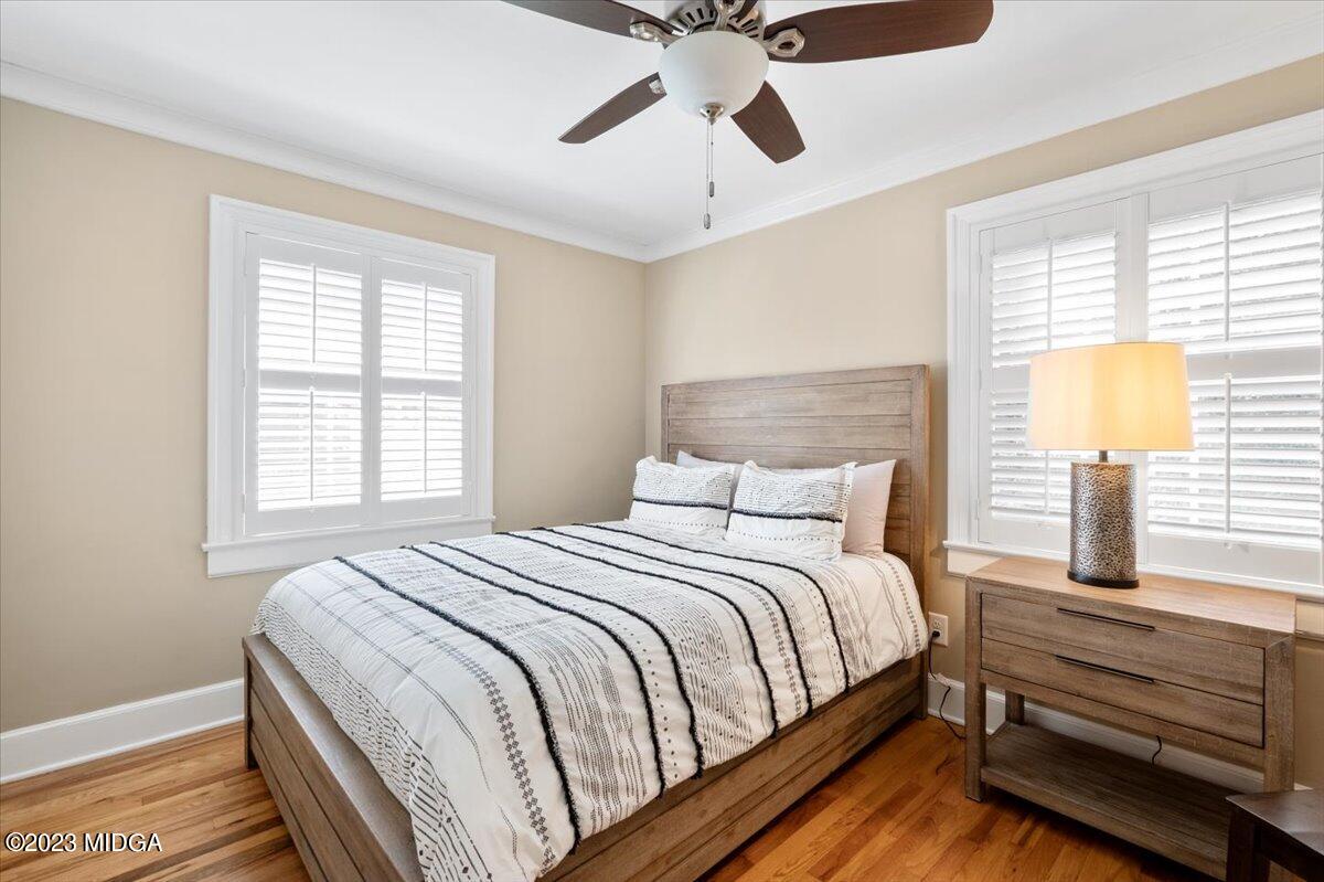 394 Overlook Road Macon, GA 31204 - Photo 15 of 29 a bedroom with a bed and wooden floor