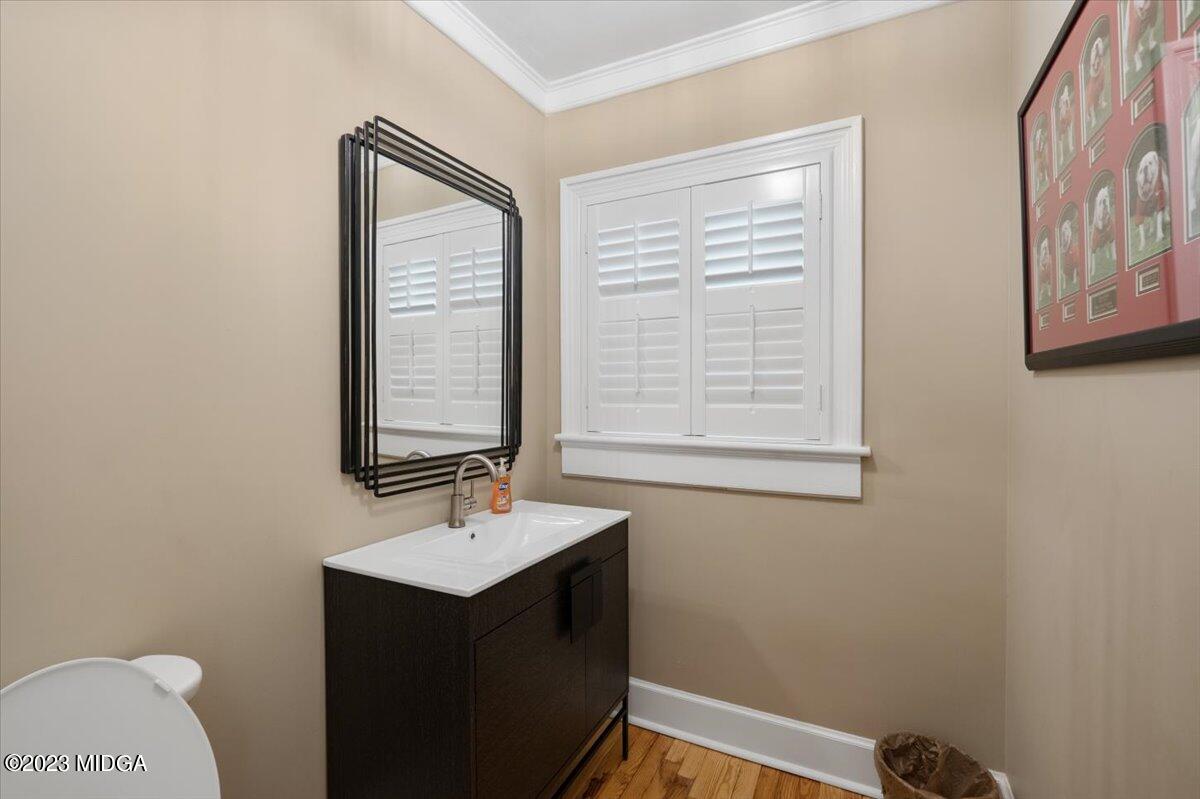 394 Overlook Road Macon, GA 31204 - Photo 16 of 29 a bathroom with a sink a mirror and a window