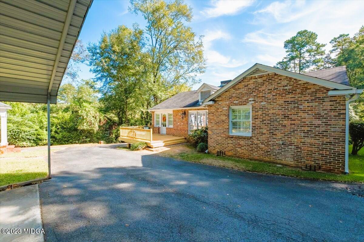 394 Overlook Road Macon, GA 31204 - Photo 25 of 29 a view of a house with backyard and a garage