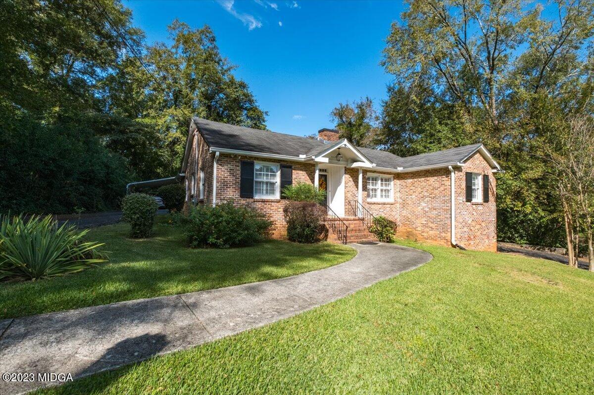 394 Overlook Road Macon, GA 31204 - Photo 29 of 29 a front view of a house with a yard and garage