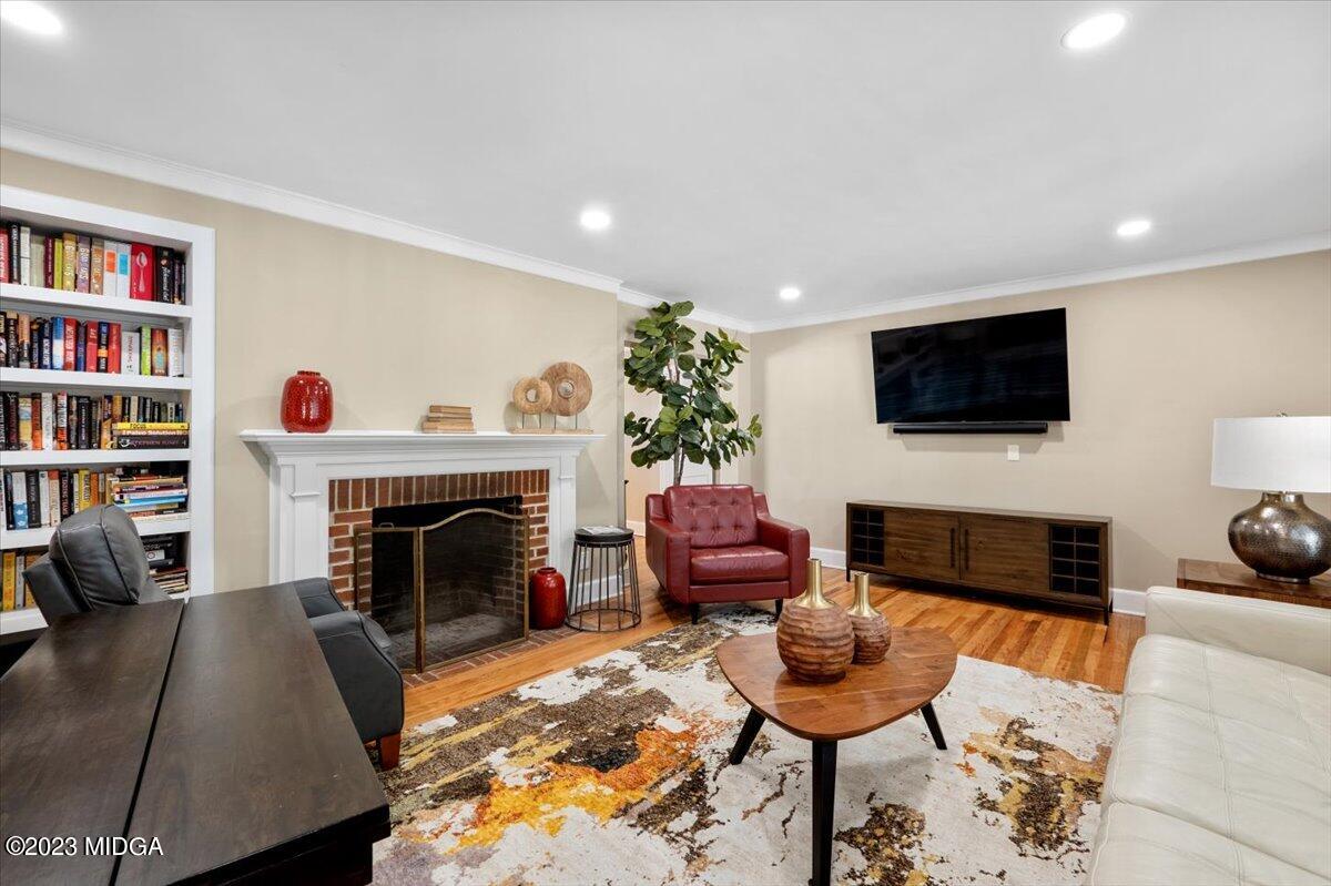 394 Overlook Road Macon, GA 31204 - Photo 9 of 29 a living room with furniture a rug and a fireplace