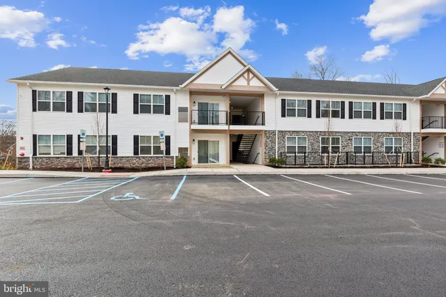 a front view of a building with a street