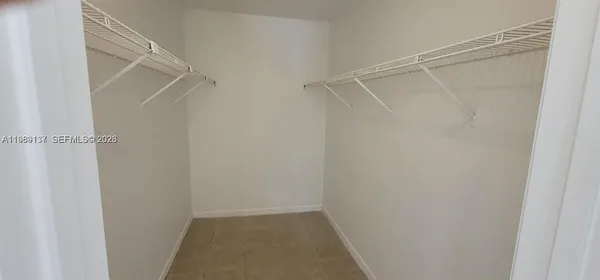 a view of an empty walk in closet