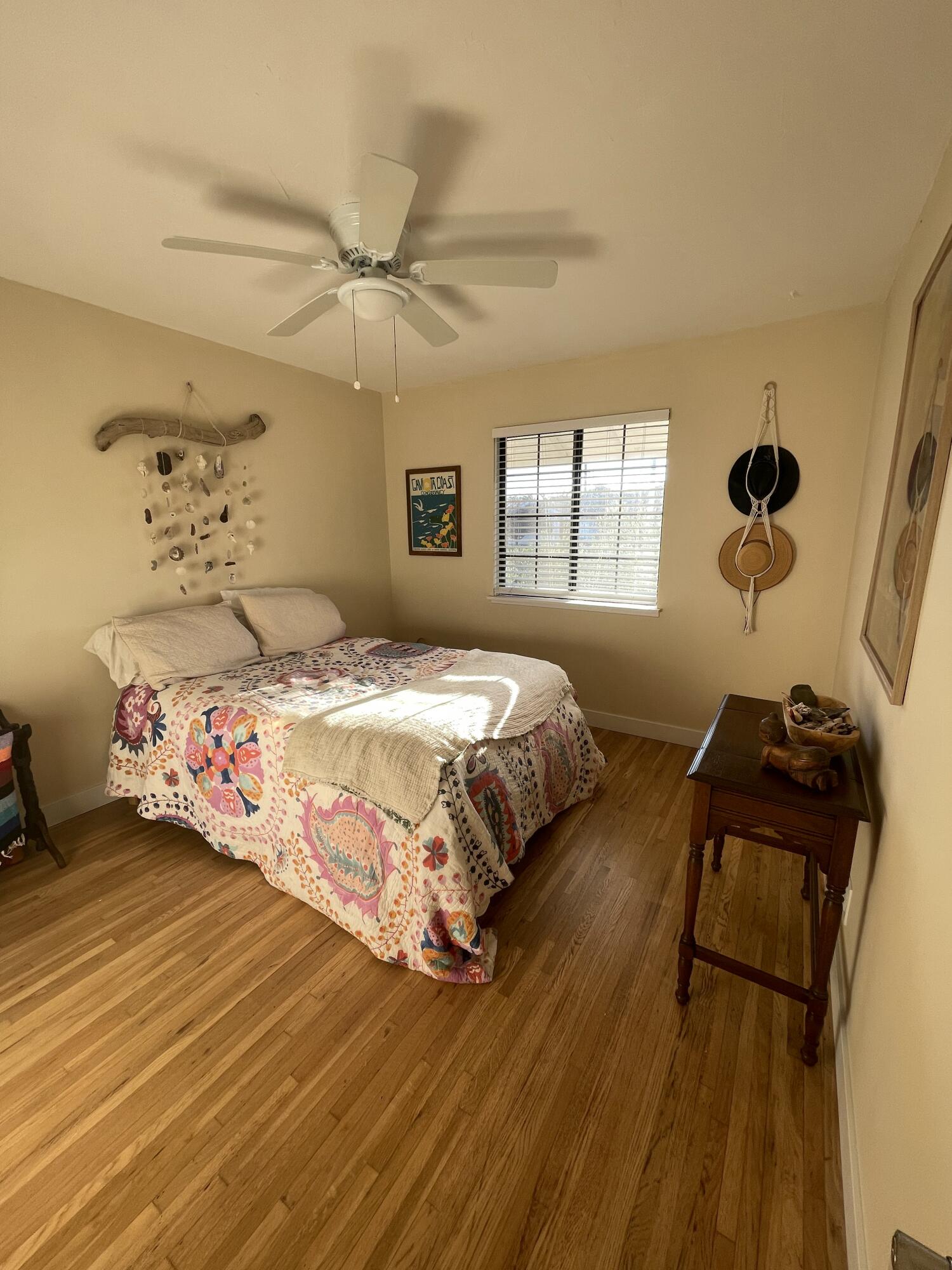 90 Brandon Drive Goleta, CA 93117 - Photo 8 of 11 a bedroom with a bed and wooden floor