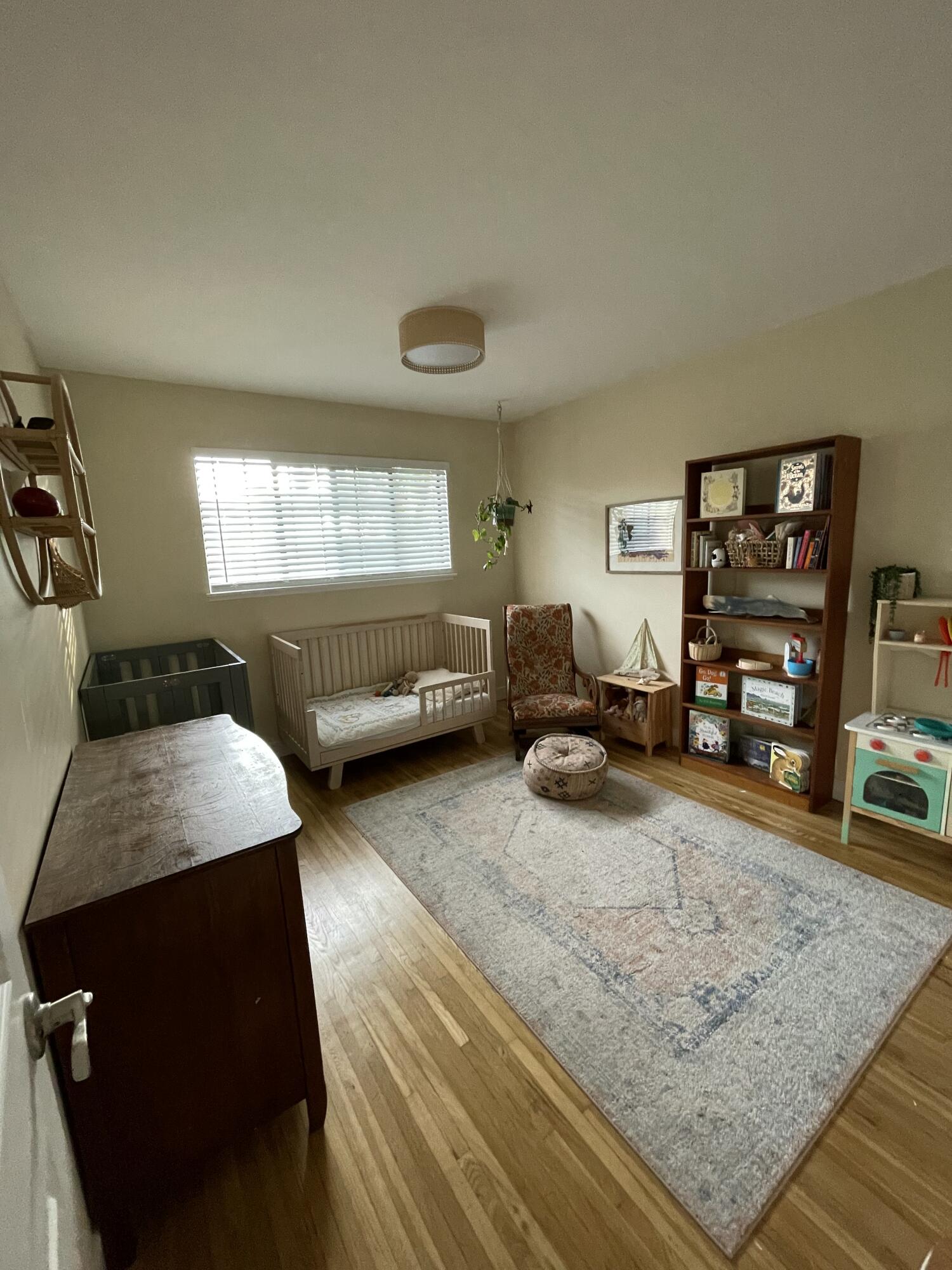 90 Brandon Drive Goleta, CA 93117 - Photo 9 of 11 a bedroom with furniture and a wooden floor