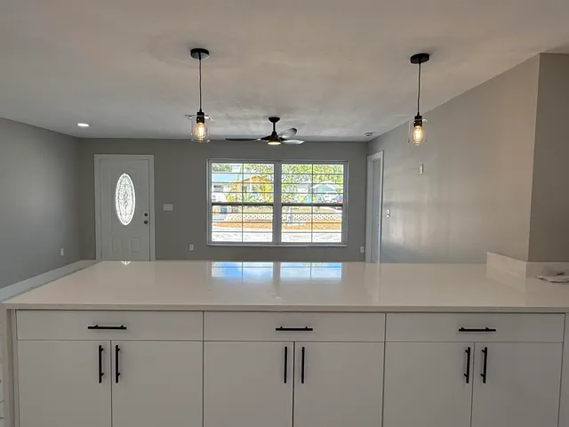 a view of a kitchen with a dishwasher and a window