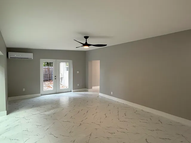 a view of an empty room with a window