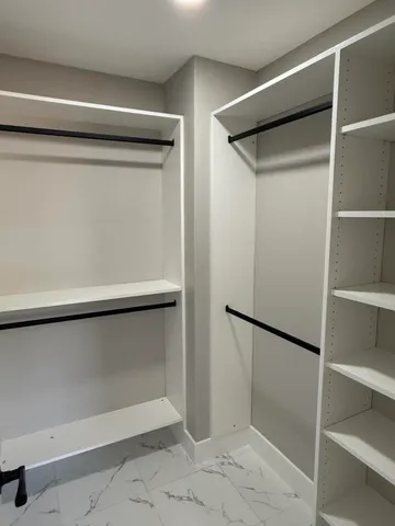 a view of an empty walk in closet