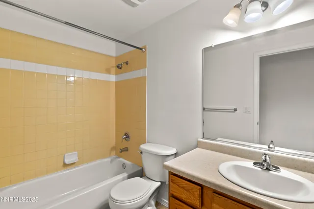 a bathroom with a sink a toilet and a bathtub