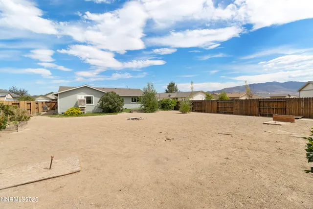 an aerial view of a house with a lake view
