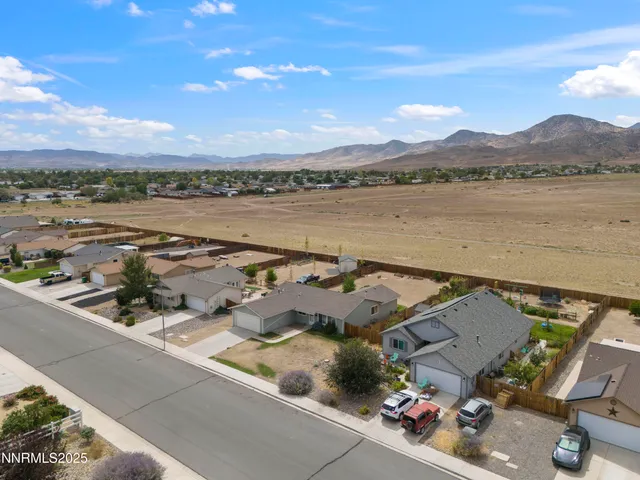 an aerial view of a house with a lake view