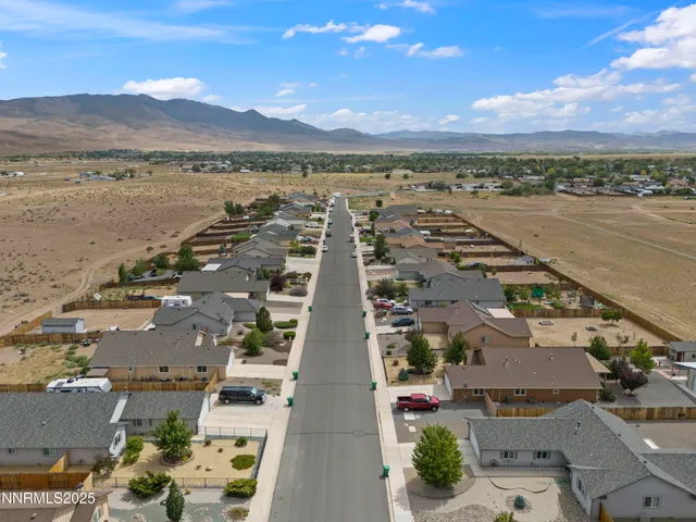 an aerial view of houses with outdoor space
