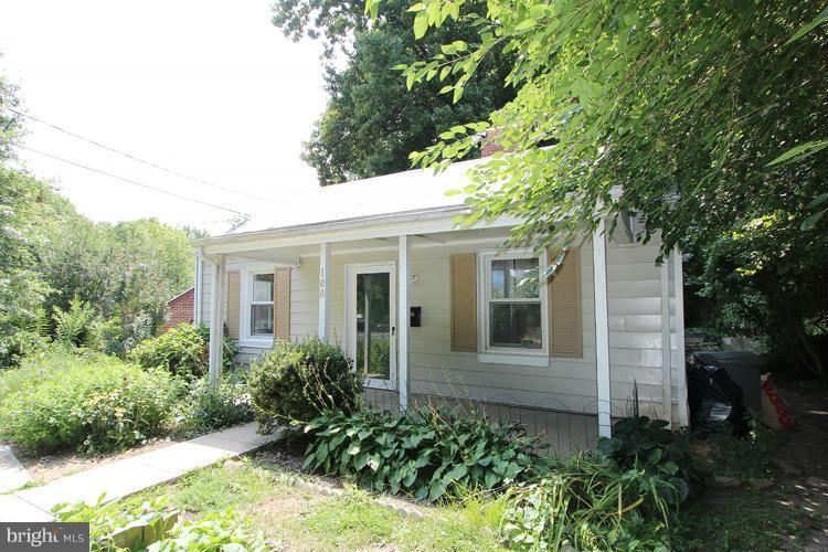100 Ritchie Avenue Silver Spring, MD 20912 - Photo 2 of 21 a view of a white house next to a yard with potted plants