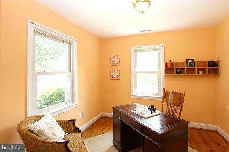 100 Ritchie Avenue Silver Spring, MD 20912 - Photo 11 of 21 a living room with furniture and a window