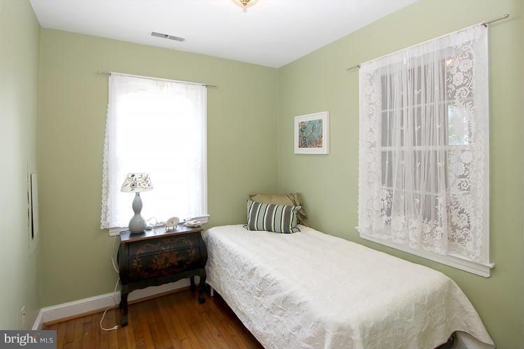 100 Ritchie Avenue Silver Spring, MD 20912 - Photo 12 of 21 a bedroom with a bed and a window