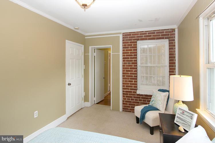 100 Ritchie Avenue Silver Spring, MD 20912 - Photo 16 of 21 a bedroom with furniture and a window