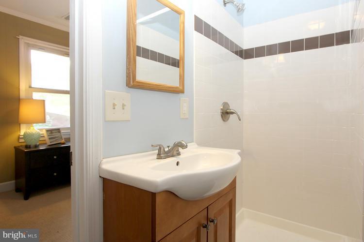 100 Ritchie Avenue Silver Spring, MD 20912 - Photo 17 of 21 a bathroom with a sink and a mirror