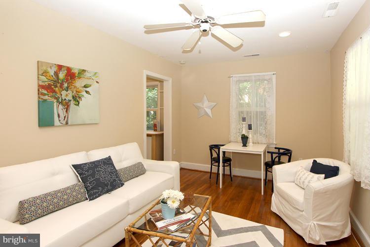 100 Ritchie Avenue Silver Spring, MD 20912 - Photo 4 of 21 a living room with furniture and a wooden floor