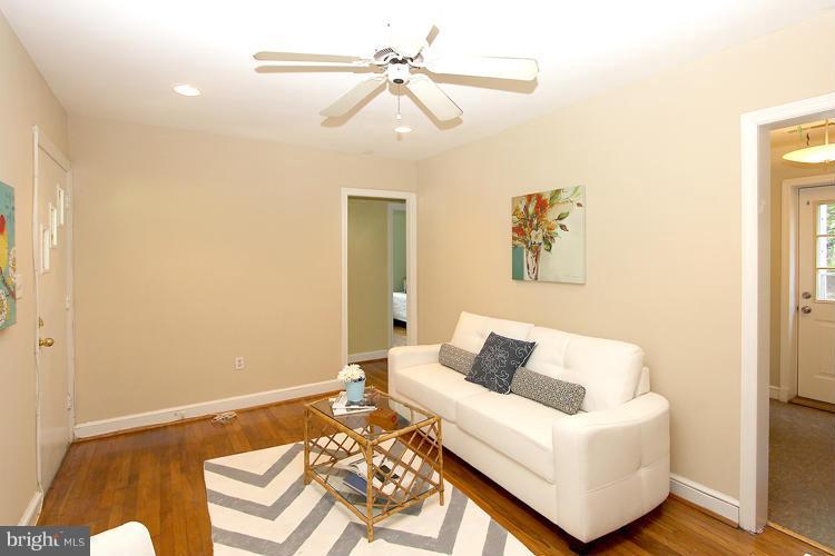 100 Ritchie Avenue Silver Spring, MD 20912 - Photo 6 of 21 a living room with furniture and a rug
