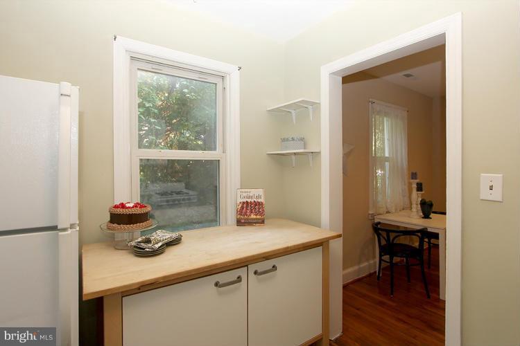 100 Ritchie Avenue Silver Spring, MD 20912 - Photo 9 of 21 a kitchen with a sink cabinets and wooden floor