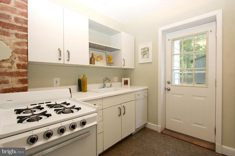 100 Ritchie Avenue Silver Spring, MD 20912 - Photo 10 of 21 a kitchen with a stove and a sink