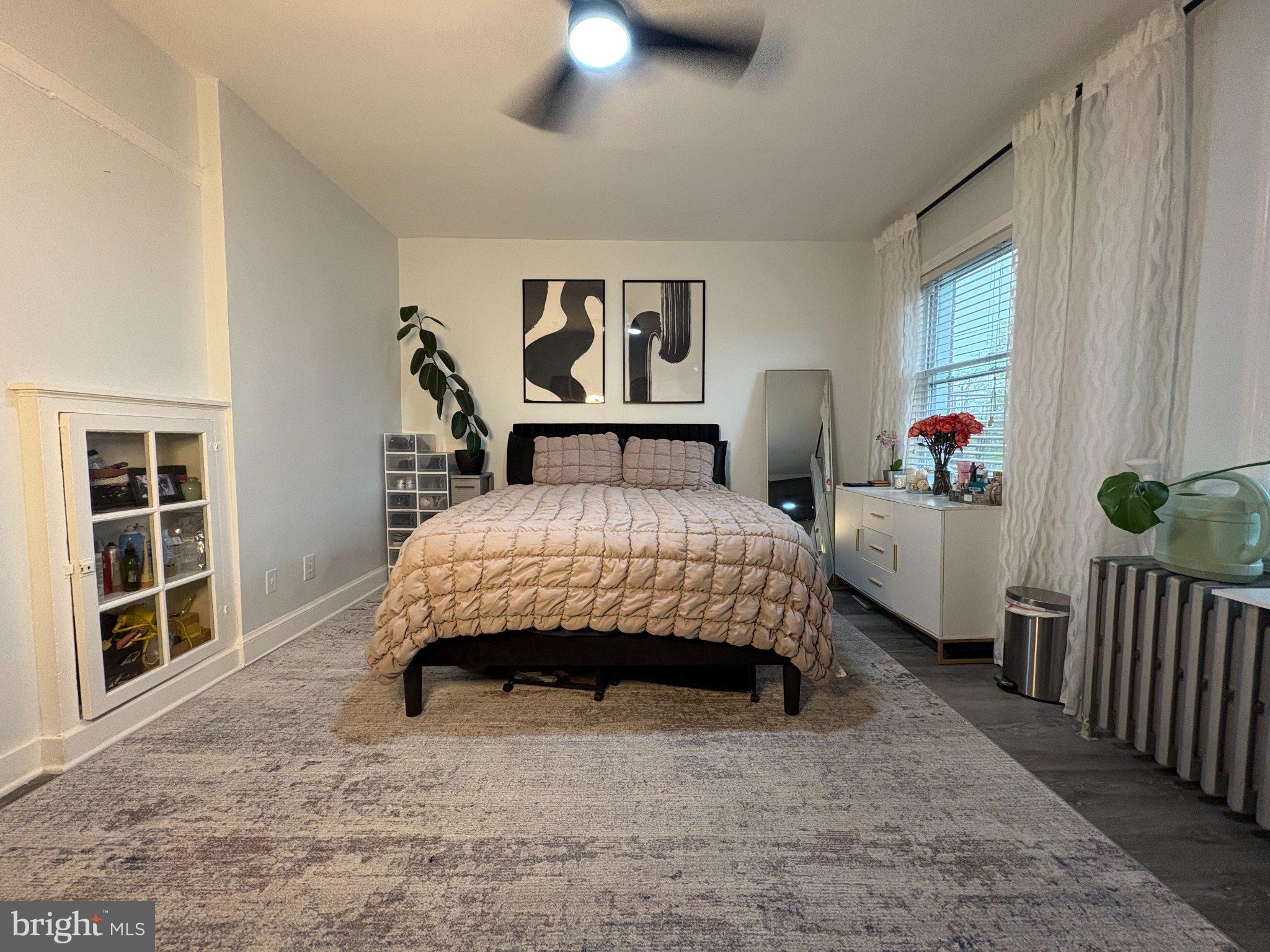 165 35th Street Northeast, Unit 3 Washington, DC 20019 - Photo 1 of 16 a bedroom with a bed and a window