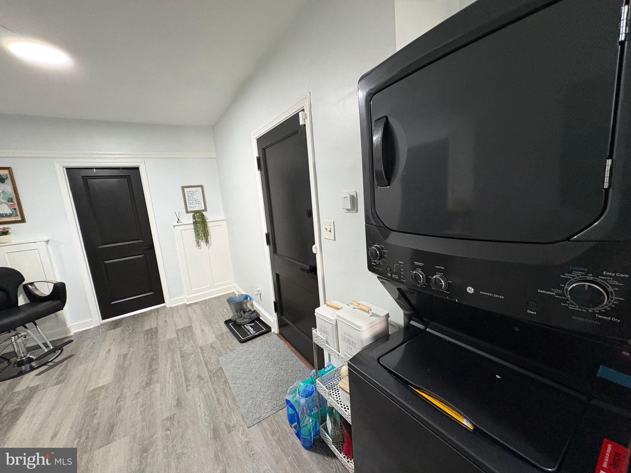 165 35th Street Northeast, Unit 3 Washington, DC 20019 - Photo 11 of 16 a room with wooden floor and furniture