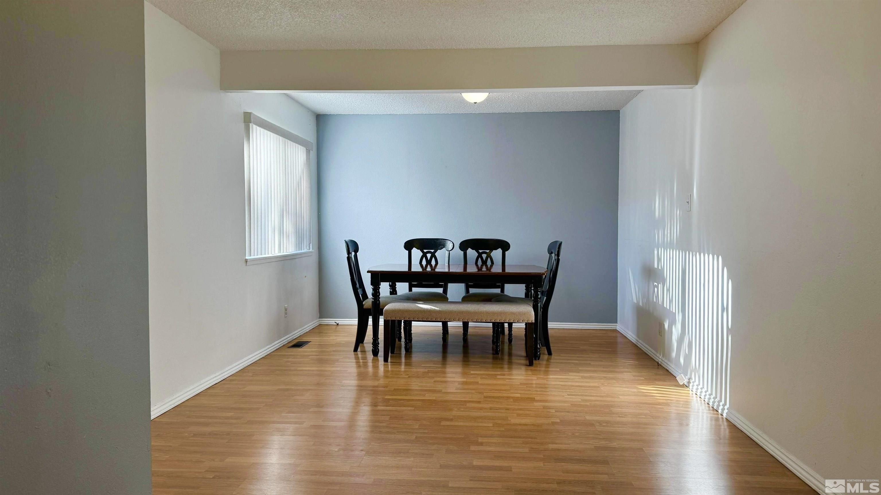 3320 Downey Avenue Reno, NV 89503 - Photo 2 of 20 a view of a dining room with furniture and wooden floor