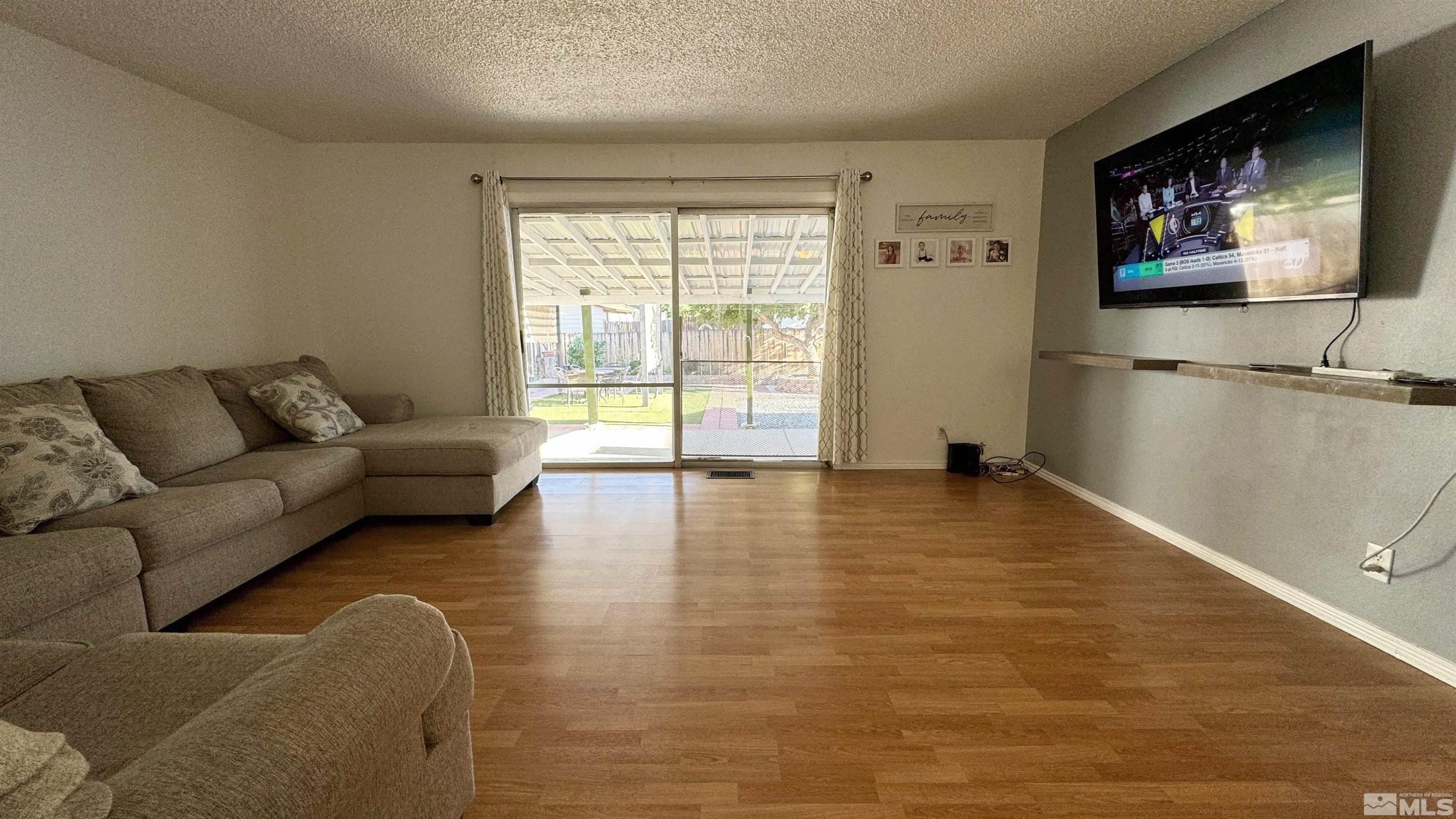 3320 Downey Avenue Reno, NV 89503 - Photo 3 of 20 a living room with furniture and a flat screen tv