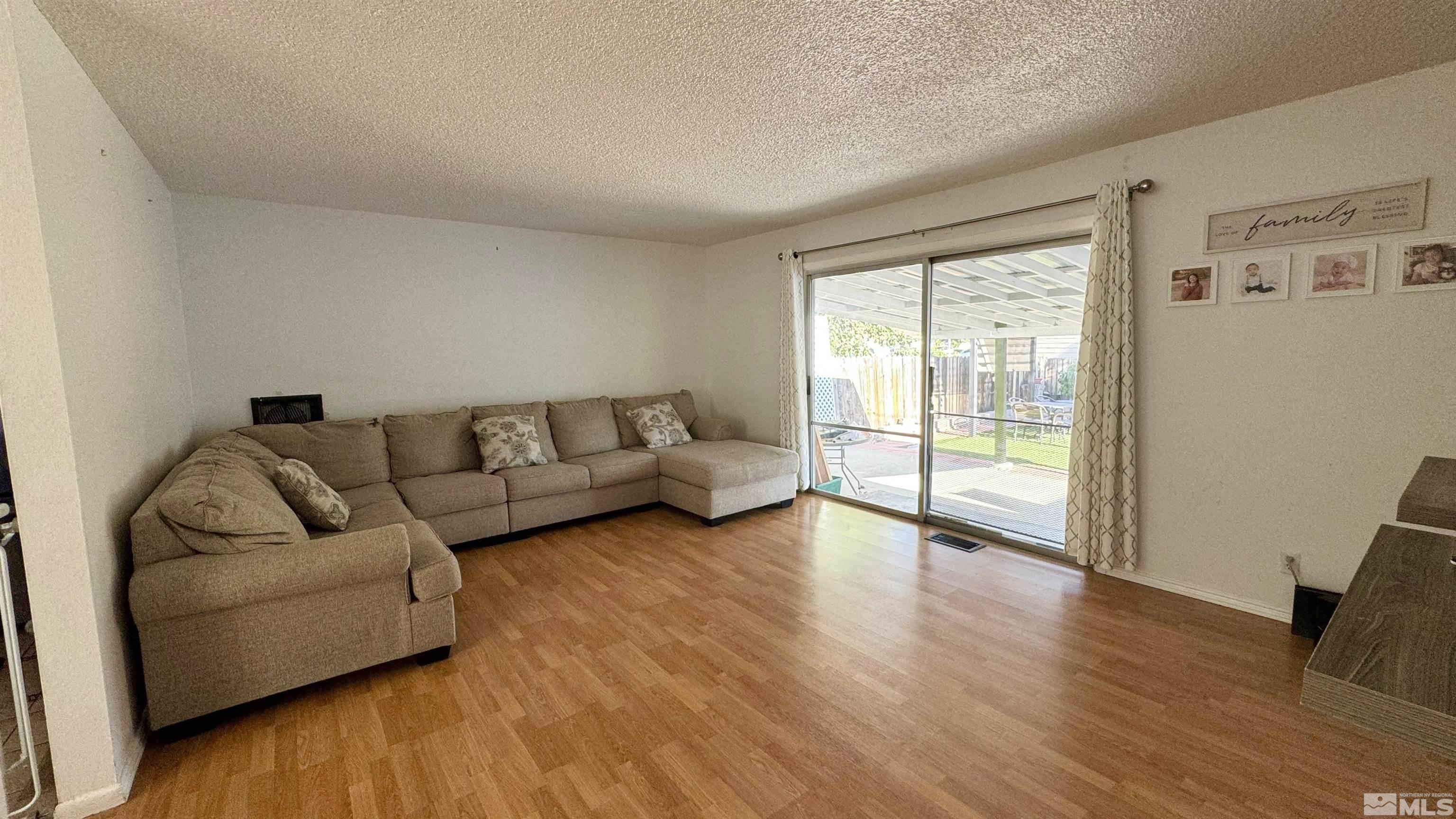 3320 Downey Avenue Reno, NV 89503 - Photo 4 of 20 a living room with furniture and a large window