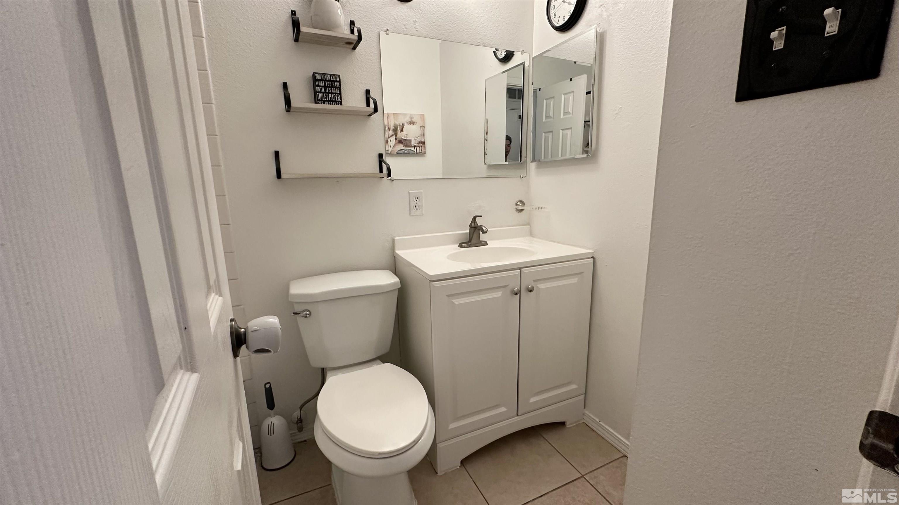 3320 Downey Avenue Reno, NV 89503 - Photo 8 of 20 a bathroom with a toilet and a sink