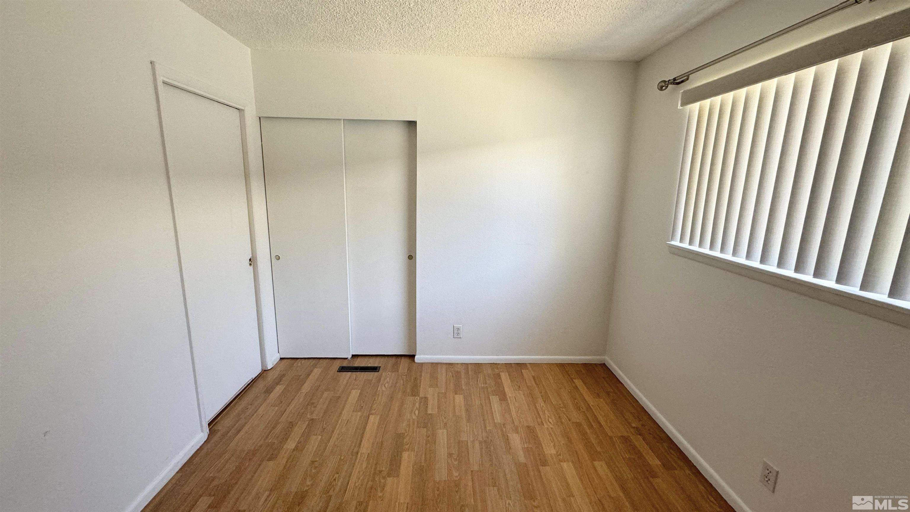 3320 Downey Avenue Reno, NV 89503 - Photo 9 of 20 a view of a room with wooden floor and a window