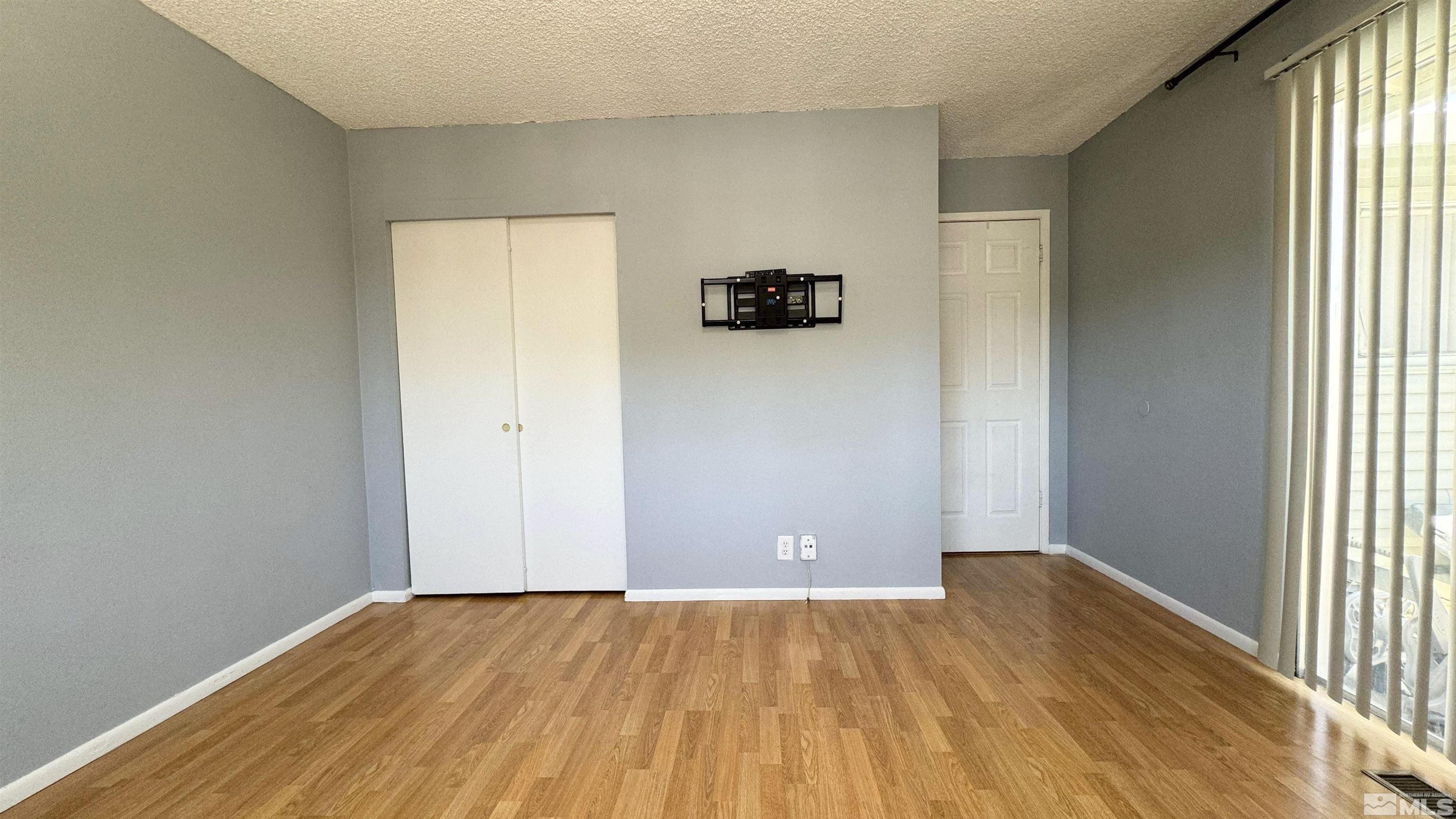 3320 Downey Avenue Reno, NV 89503 - Photo 10 of 20 an empty room with a wooden floor and closet