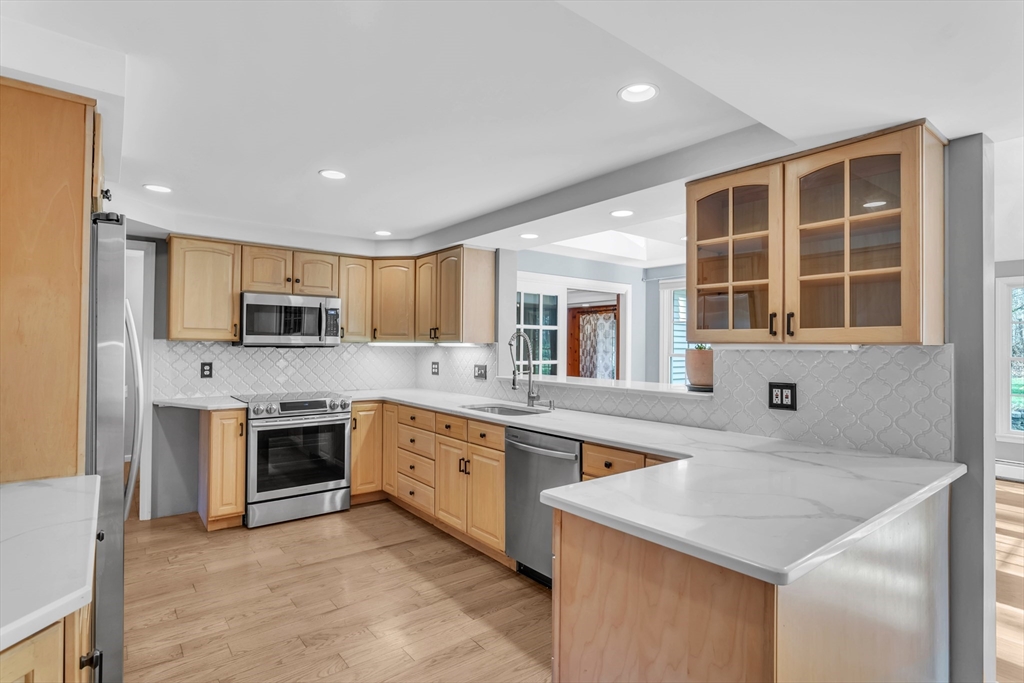 10 Russell Road Wilbraham, MA 01095 - Photo 3 of 42 a kitchen with stainless steel appliances granite countertop a stove and a sink