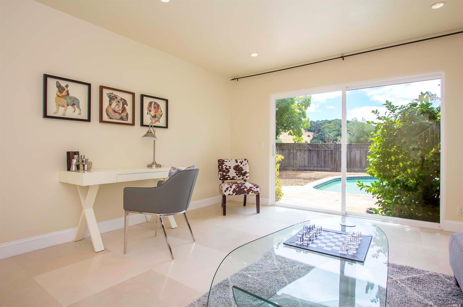 4 Montevideo Way San Rafael, CA 94903 - Photo 1 of 1 a living room with furniture and a large window