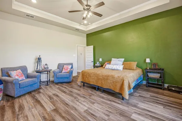 a bedroom with a bed and a couch