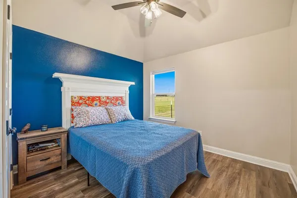 a bedroom with a bed and a dresser