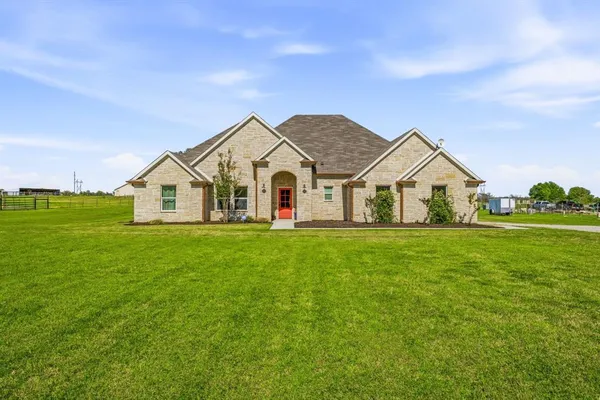 a view of a house with a yard and garage