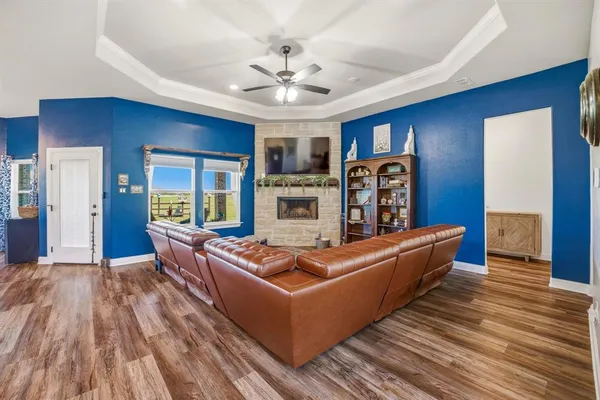 a living room with furniture and wooden floor