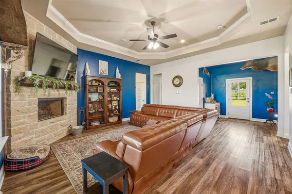 a living room with furniture and a fireplace